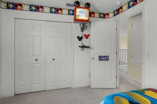 a bathroom with a sink toilet vanity and shower