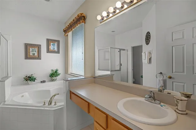 a view of storage and utility room with washer and dryer