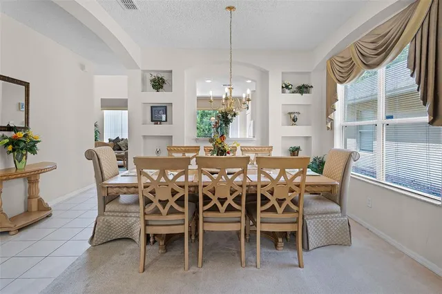 a view of a dining room with furniture and window