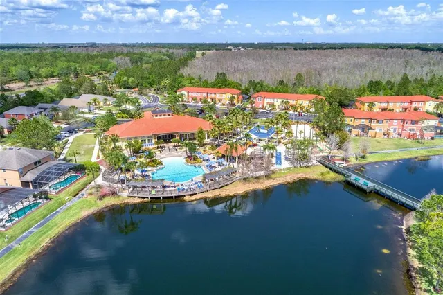 an aerial view of a house with swimming pool