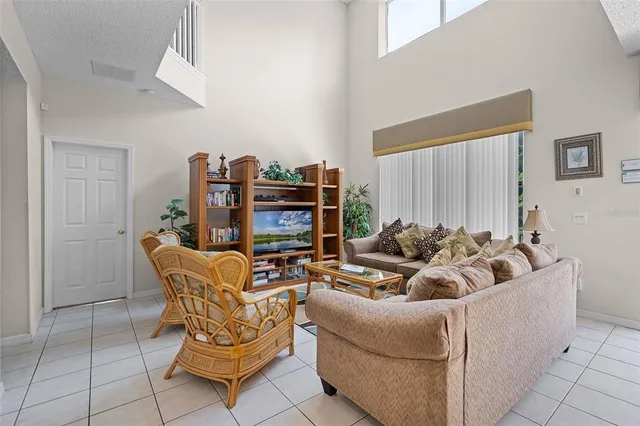 a living room with furniture a desk and chair