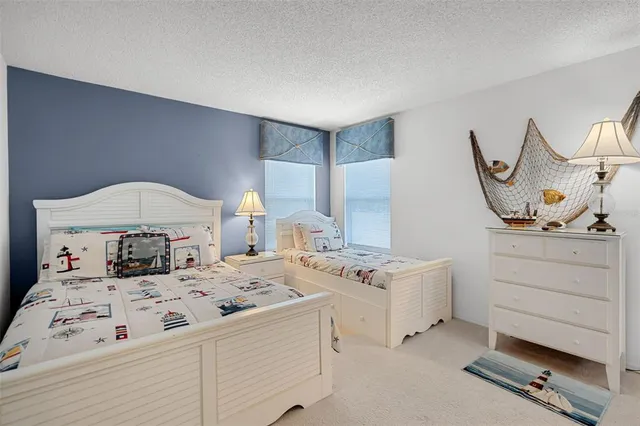 a bathroom with a sink toilet vanity and shower