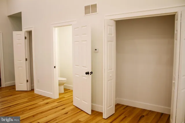 a kitchen with granite countertop a refrigerator sink and stove