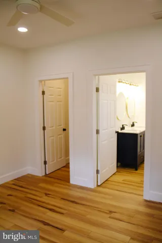 a view of a room with wooden floor