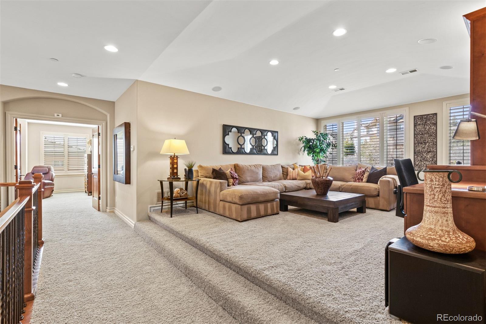 981 Buffalo Ridge Road Castle Pines, CO 80108 - Photo 15 of 39 a living room with furniture and a large window