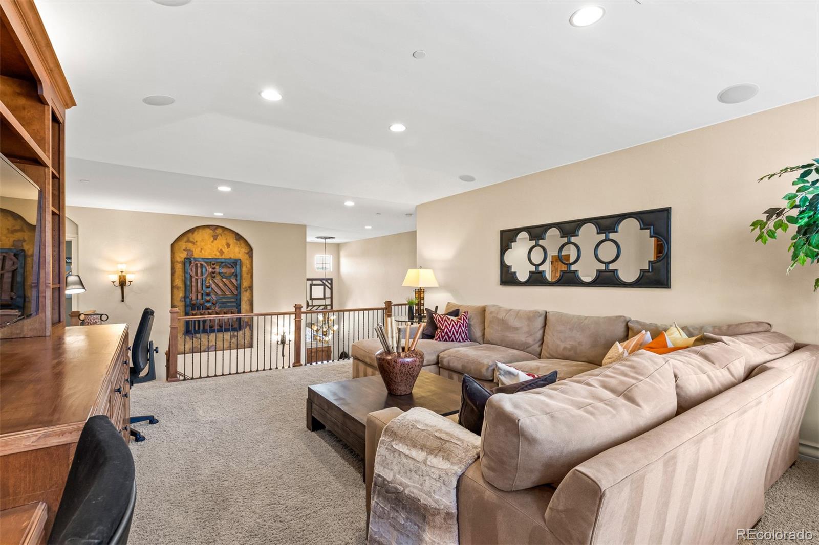 981 Buffalo Ridge Road Castle Pines, CO 80108 - Photo 16 of 39 a living room with furniture and a wooden floor
