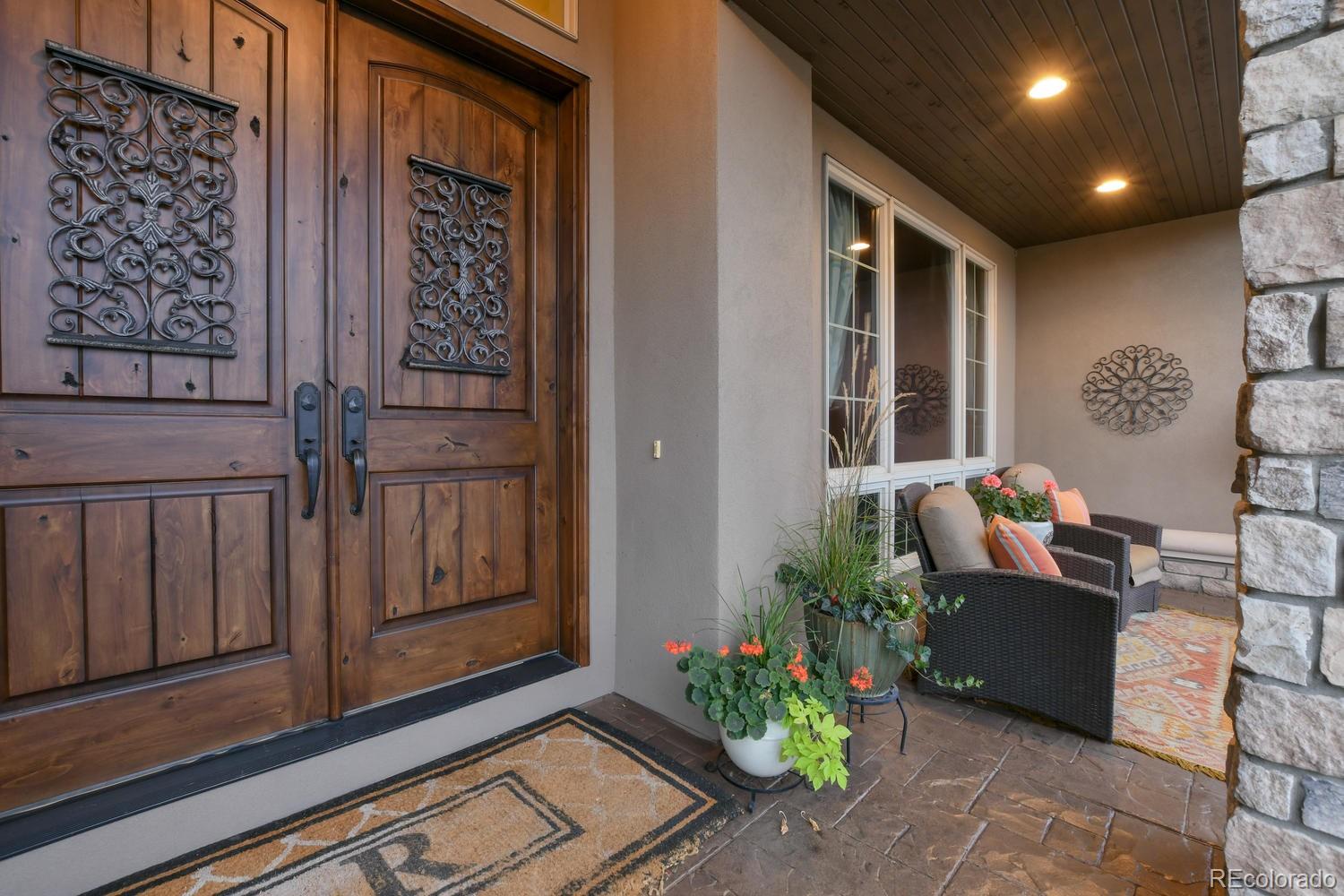 981 Buffalo Ridge Road Castle Pines, CO 80108 - Photo 2 of 39 a living room with furniture