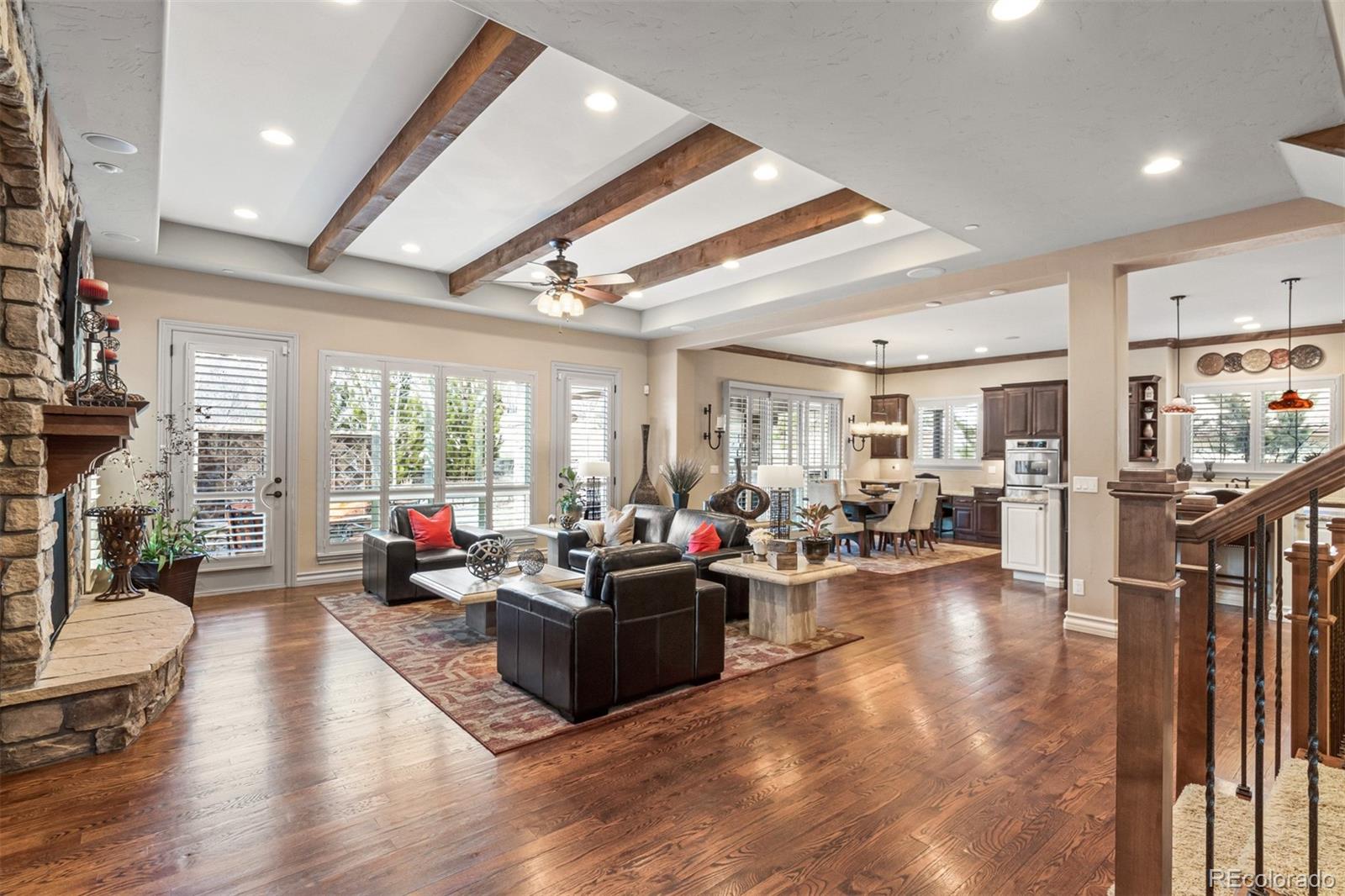 981 Buffalo Ridge Road Castle Pines, CO 80108 - Photo 3 of 39 a living room with furniture fireplace and a large window