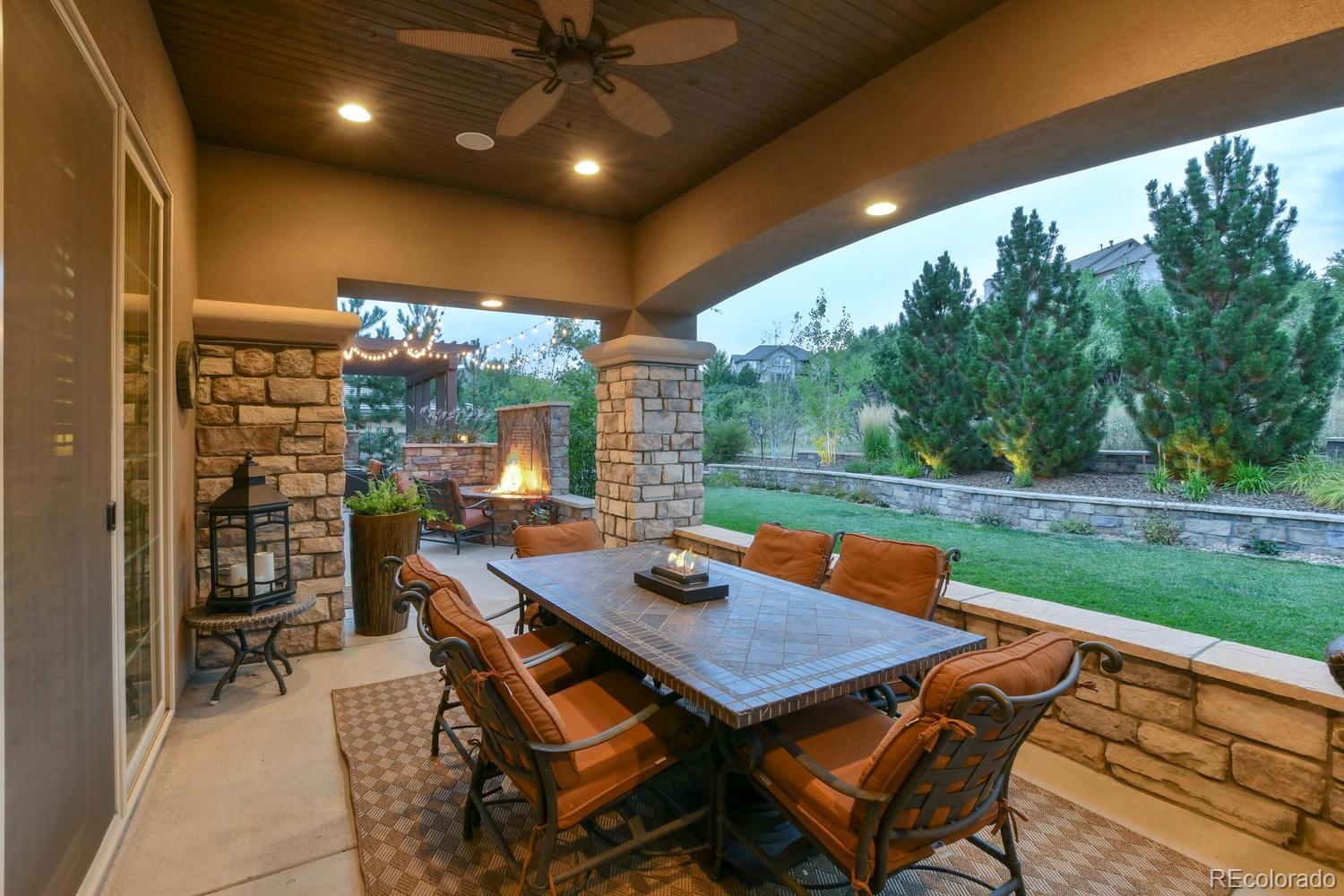 981 Buffalo Ridge Road Castle Pines, CO 80108 - Photo 34 of 39 a outdoor dining space with furniture and garden view
