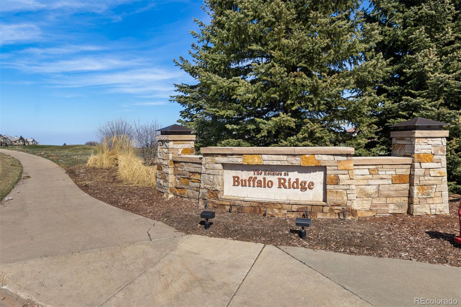 981 Buffalo Ridge Road Castle Pines, CO 80108 - Photo 39 of 39 a sign on the side of a building