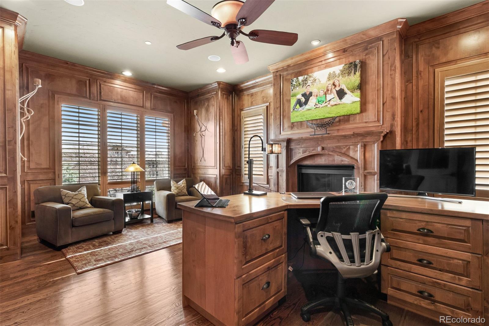 981 Buffalo Ridge Road Castle Pines, CO 80108 - Photo 10 of 39 a living room with furniture and a fireplace