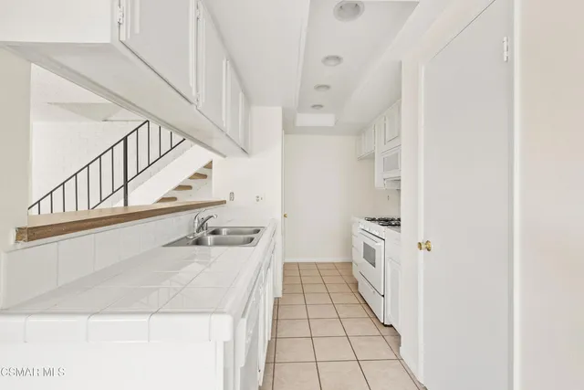 a bathroom with a sink a vanity and a mirror