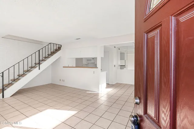 a view of an entryway with wooden floor