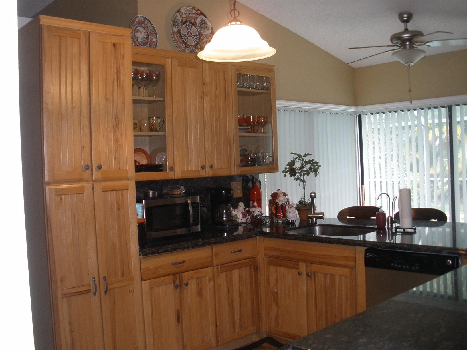 21293 Purple Sage Lane Boca Raton, FL 33428 - Photo 2 of 10 a kitchen with a sink and cabinets