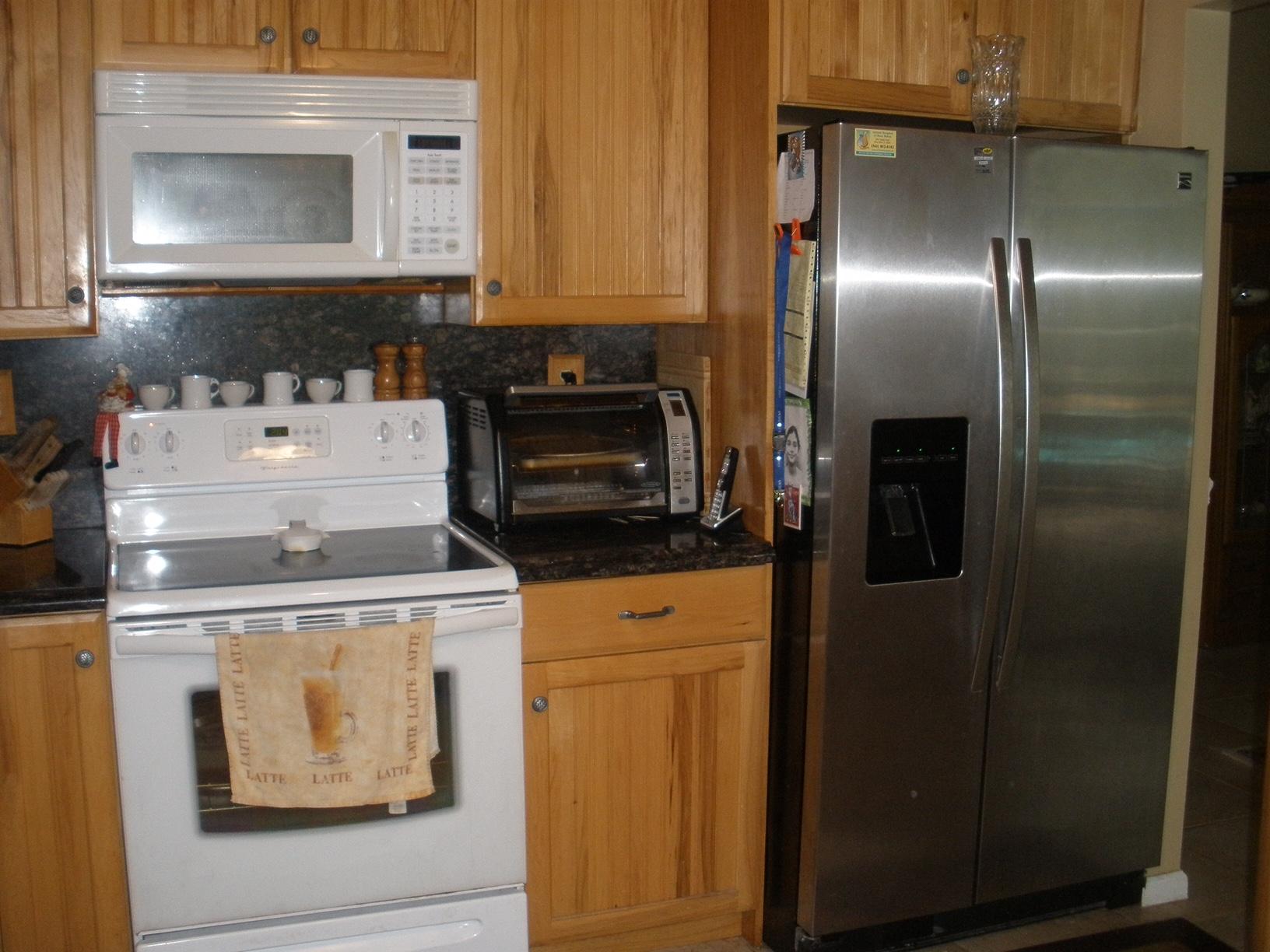 21293 Purple Sage Lane Boca Raton, FL 33428 - Photo 3 of 10 a stove top oven sitting inside of a kitchen