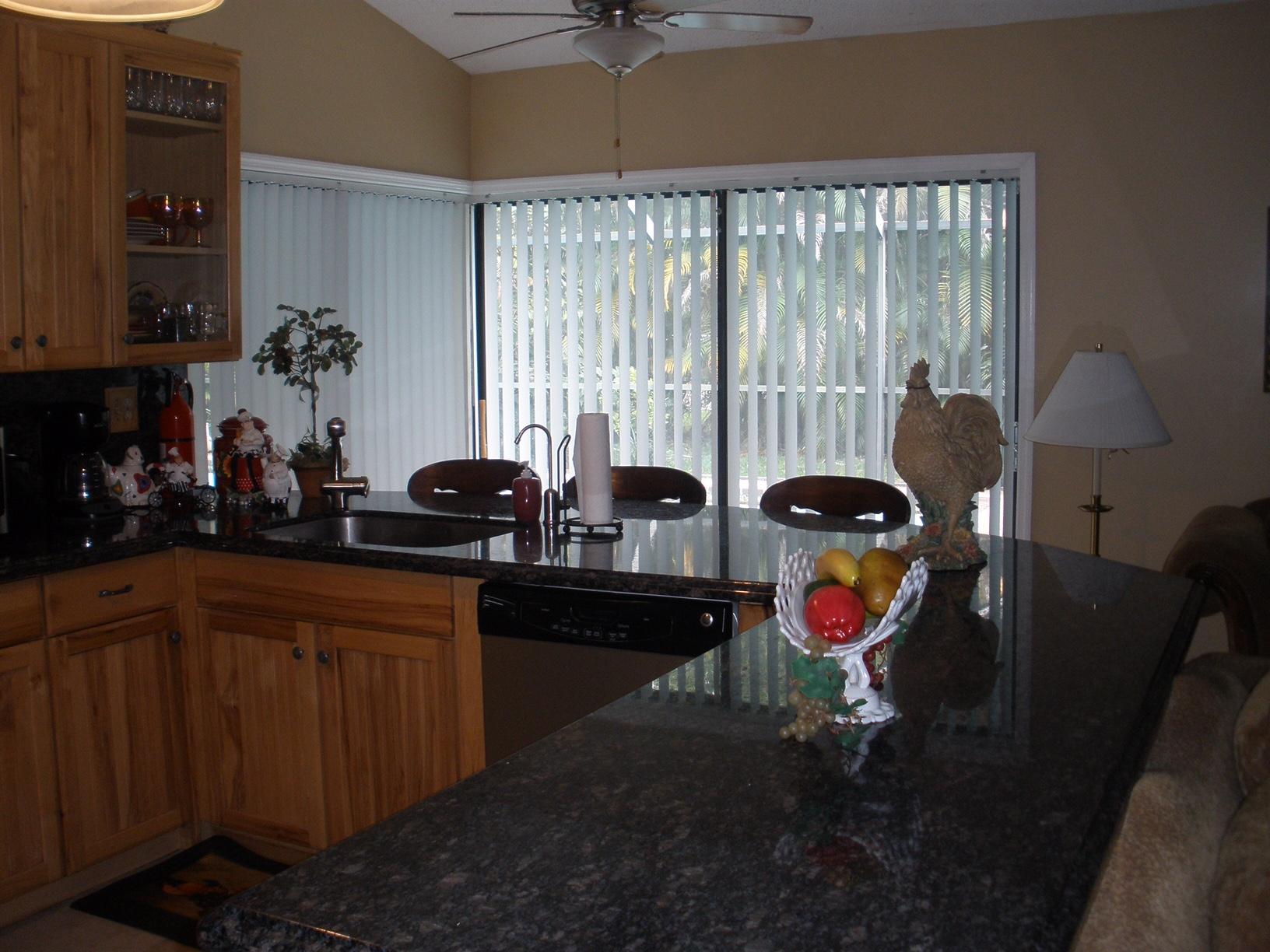 21293 Purple Sage Lane Boca Raton, FL 33428 - Photo 4 of 10 a kitchen with a sink cabinets and appliances