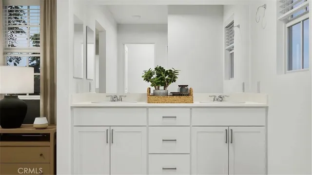 a bathroom with cabinets and sink