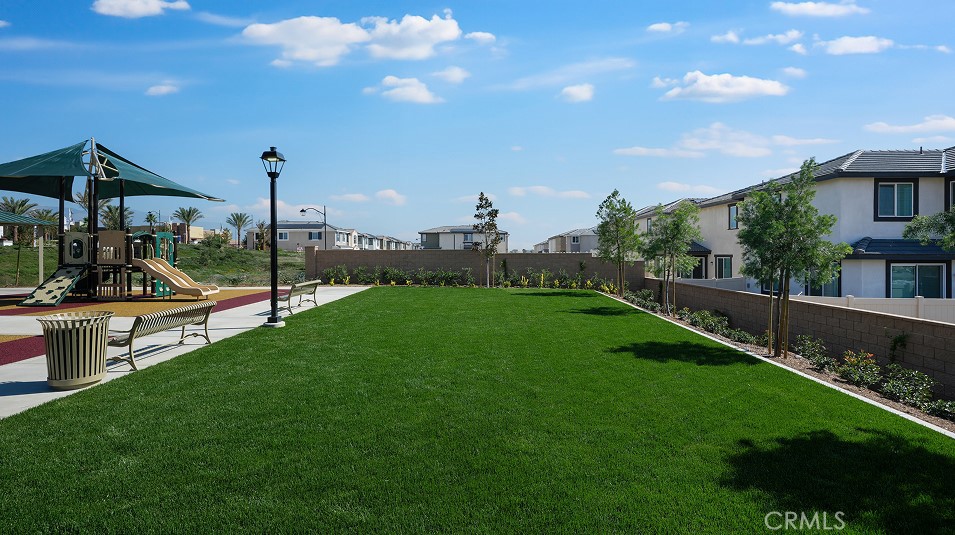 1214 Yeager Avenue Rialto, CA 92376 - Photo 18 of 21 a view of a garden with palm trees