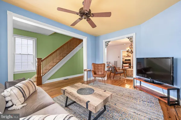 a living room with furniture and a flat screen tv
