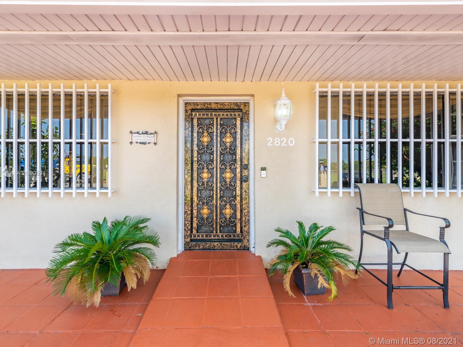 2820 Southwest 95th Avenue Miami, FL 33165 - Photo 15 of 100 a potted plant sitting in front of a house