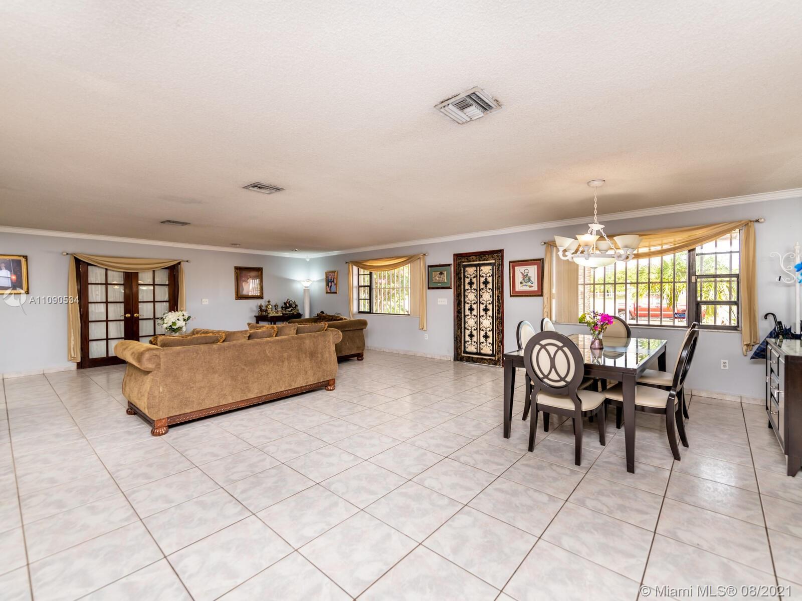 2820 Southwest 95th Avenue Miami, FL 33165 - Photo 20 of 100 a living room with furniture and a dining table