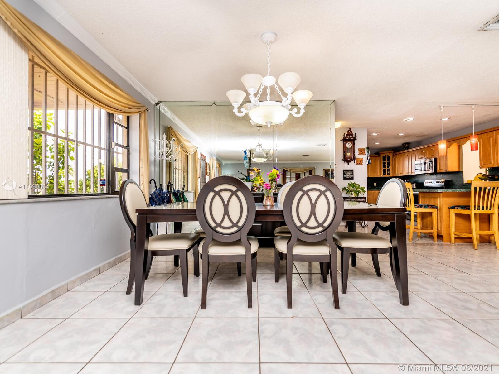 2820 Southwest 95th Avenue Miami, FL 33165 - Photo 22 of 100 a view of a dining area with furniture and a large window