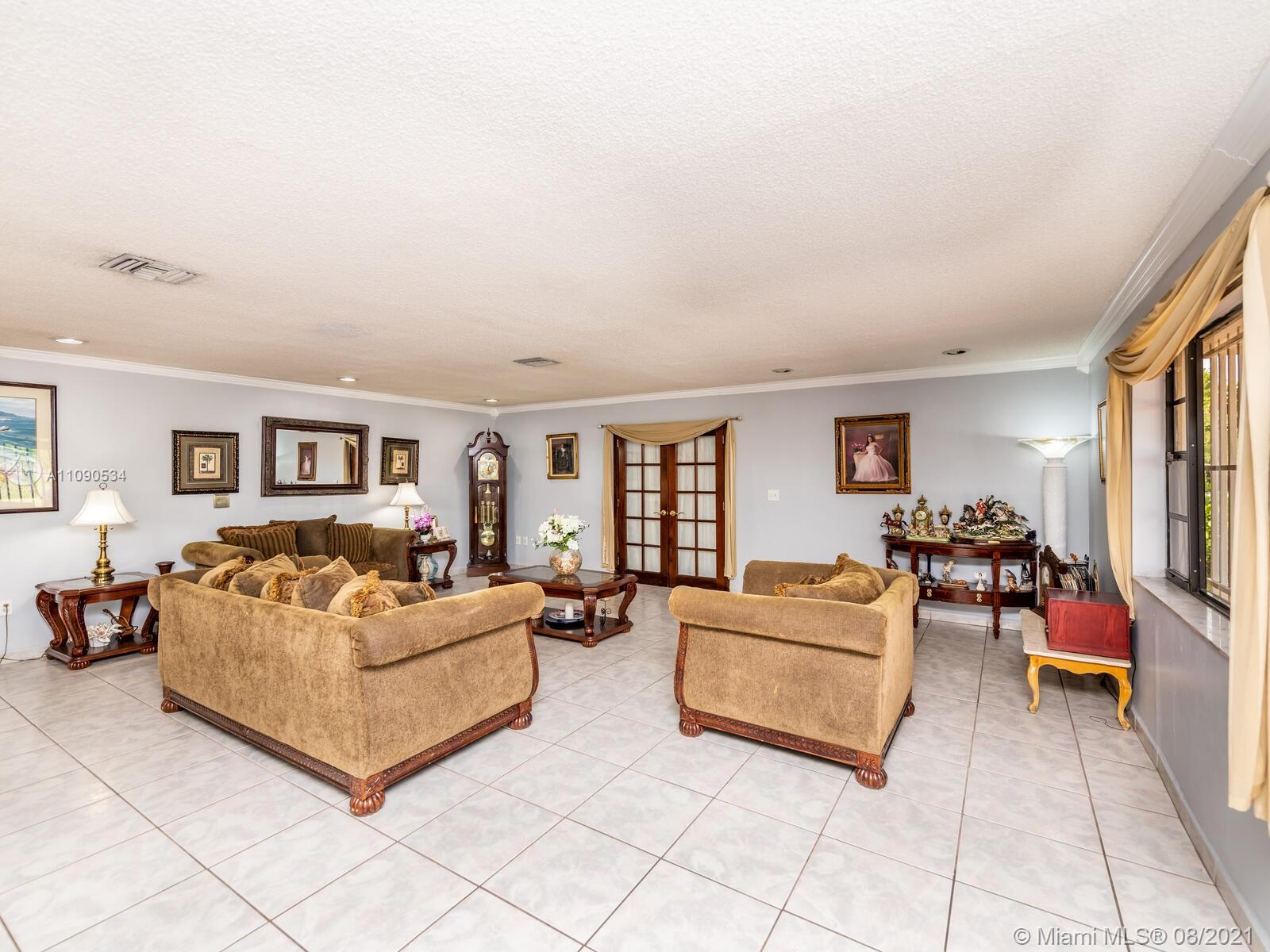 2820 Southwest 95th Avenue Miami, FL 33165 - Photo 24 of 100 a living room with furniture and a flat screen tv