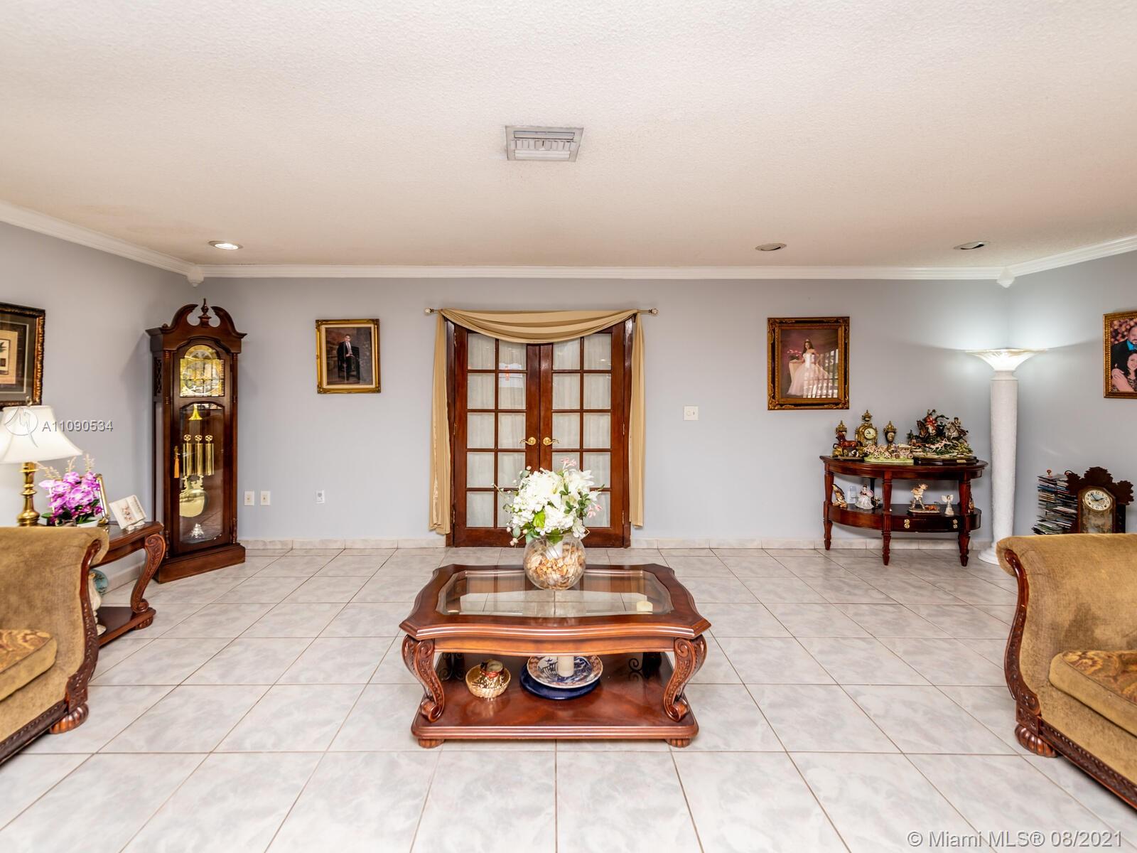 2820 Southwest 95th Avenue Miami, FL 33165 - Photo 25 of 100 a living room with furniture a dining table and a fireplace