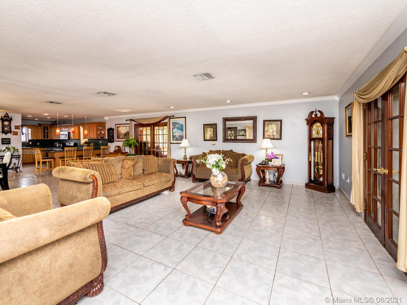 2820 Southwest 95th Avenue Miami, FL 33165 - Photo 26 of 100 a living room with furniture and a flat screen tv