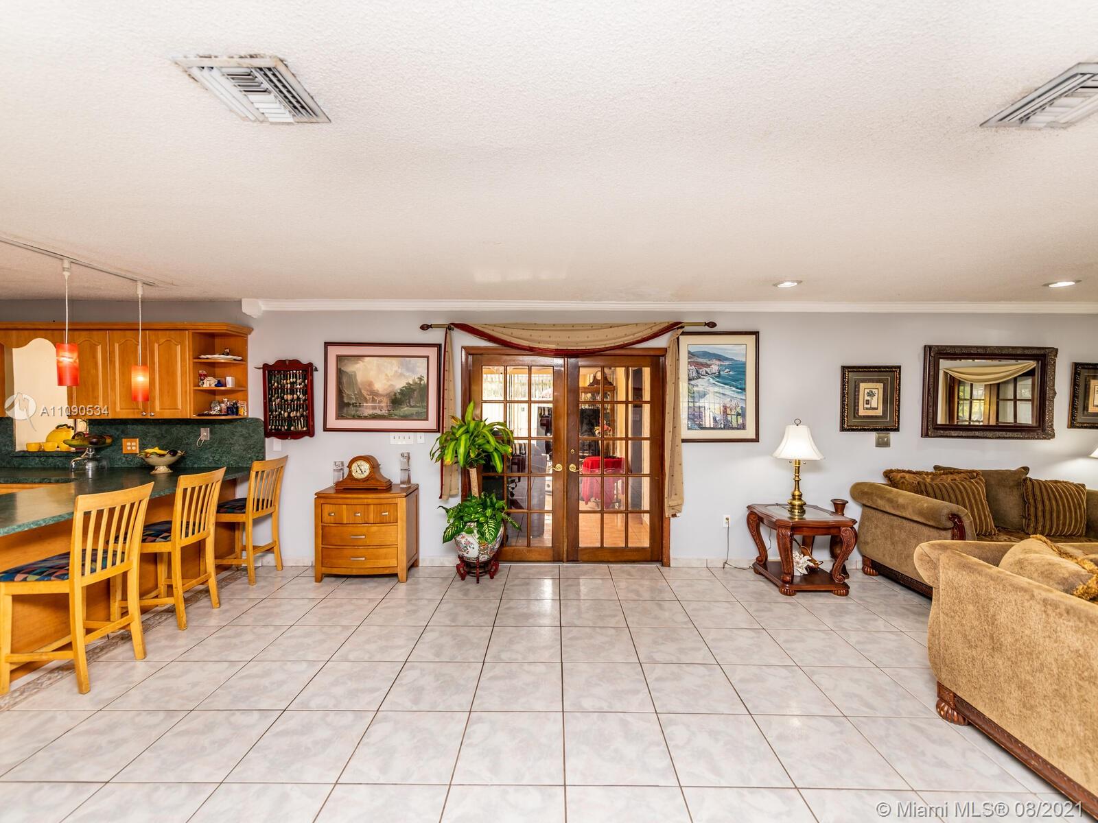 2820 Southwest 95th Avenue Miami, FL 33165 - Photo 27 of 100 a living room with furniture and a flat screen tv