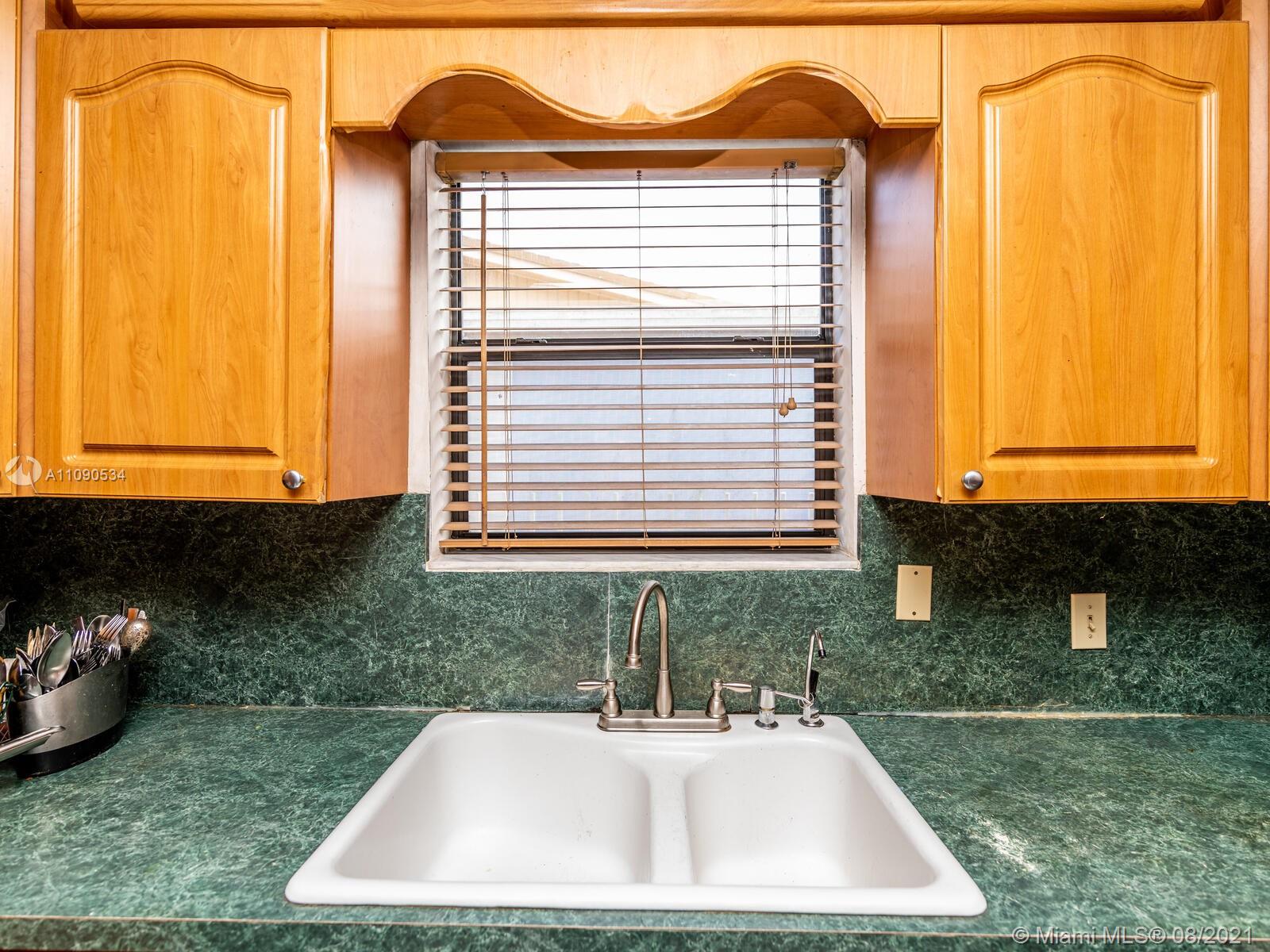 2820 Southwest 95th Avenue Miami, FL 33165 - Photo 32 of 100 a bathroom with a sink and a window