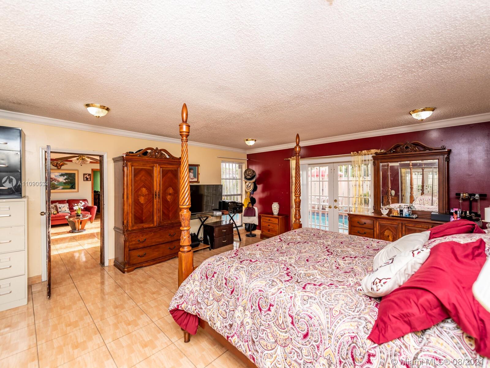 2820 Southwest 95th Avenue Miami, FL 33165 - Photo 39 of 100 a bed room with a bed and furniture