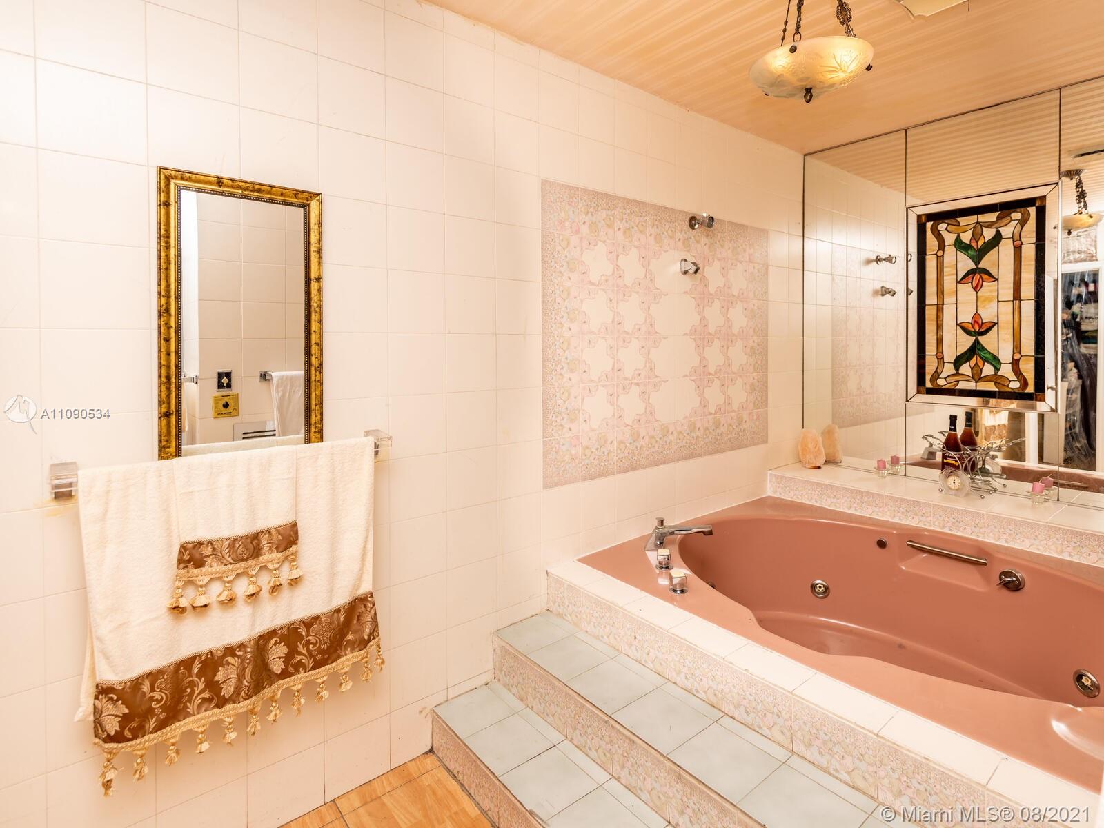 2820 Southwest 95th Avenue Miami, FL 33165 - Photo 42 of 100 a bathroom with a bathtub and a shower