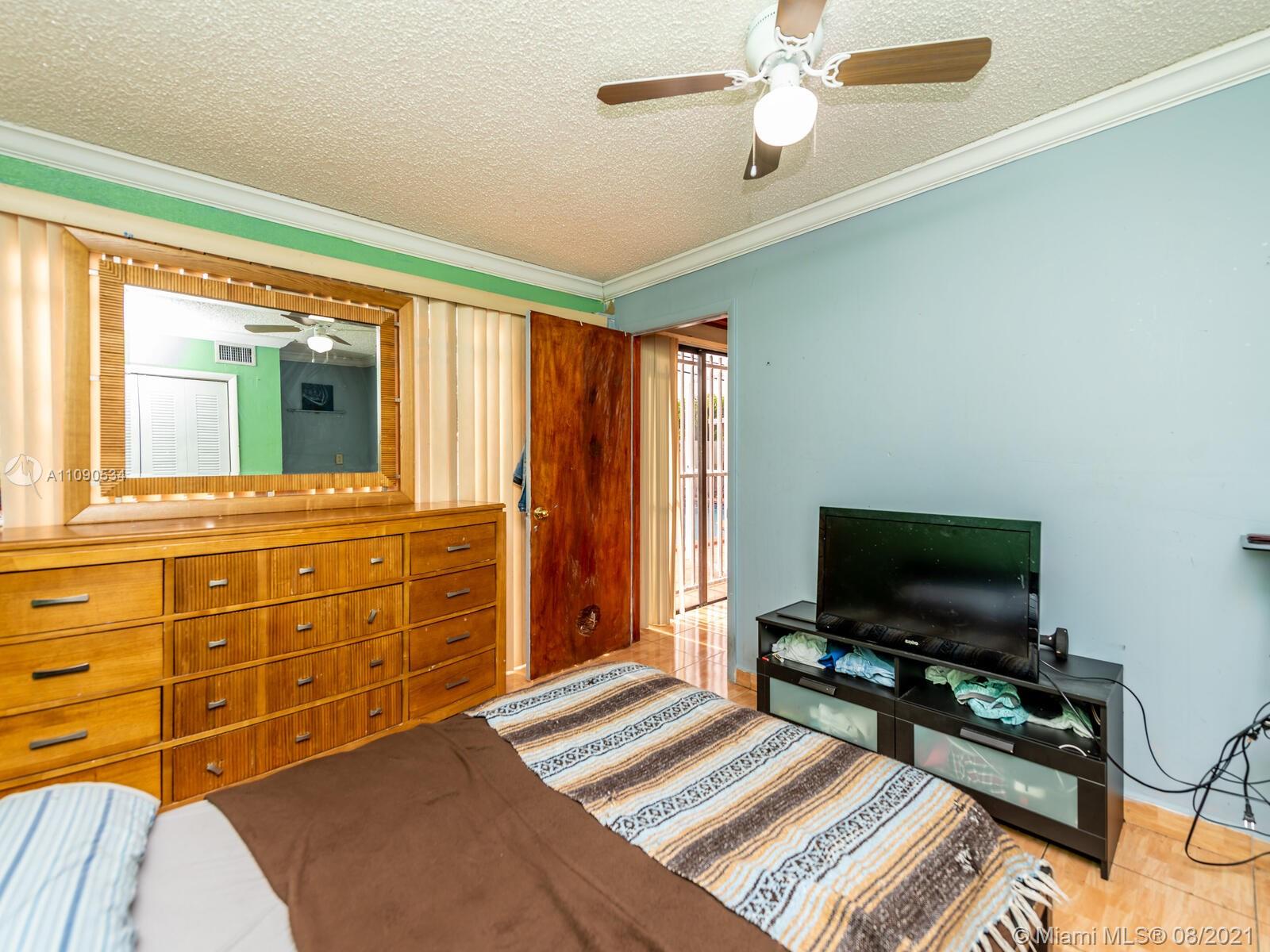 2820 Southwest 95th Avenue Miami, FL 33165 - Photo 51 of 100 a living room with furniture and a flat screen tv