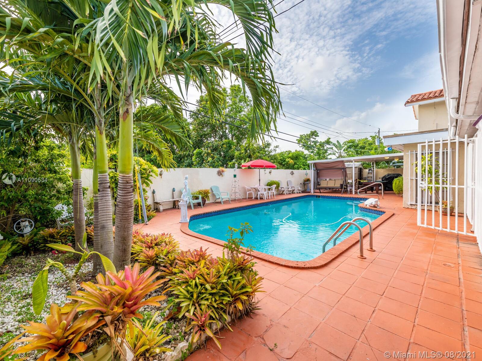2820 Southwest 95th Avenue Miami, FL 33165 - Photo 54 of 100 an aerial view of a swimming pool with an outdoor seating and yard