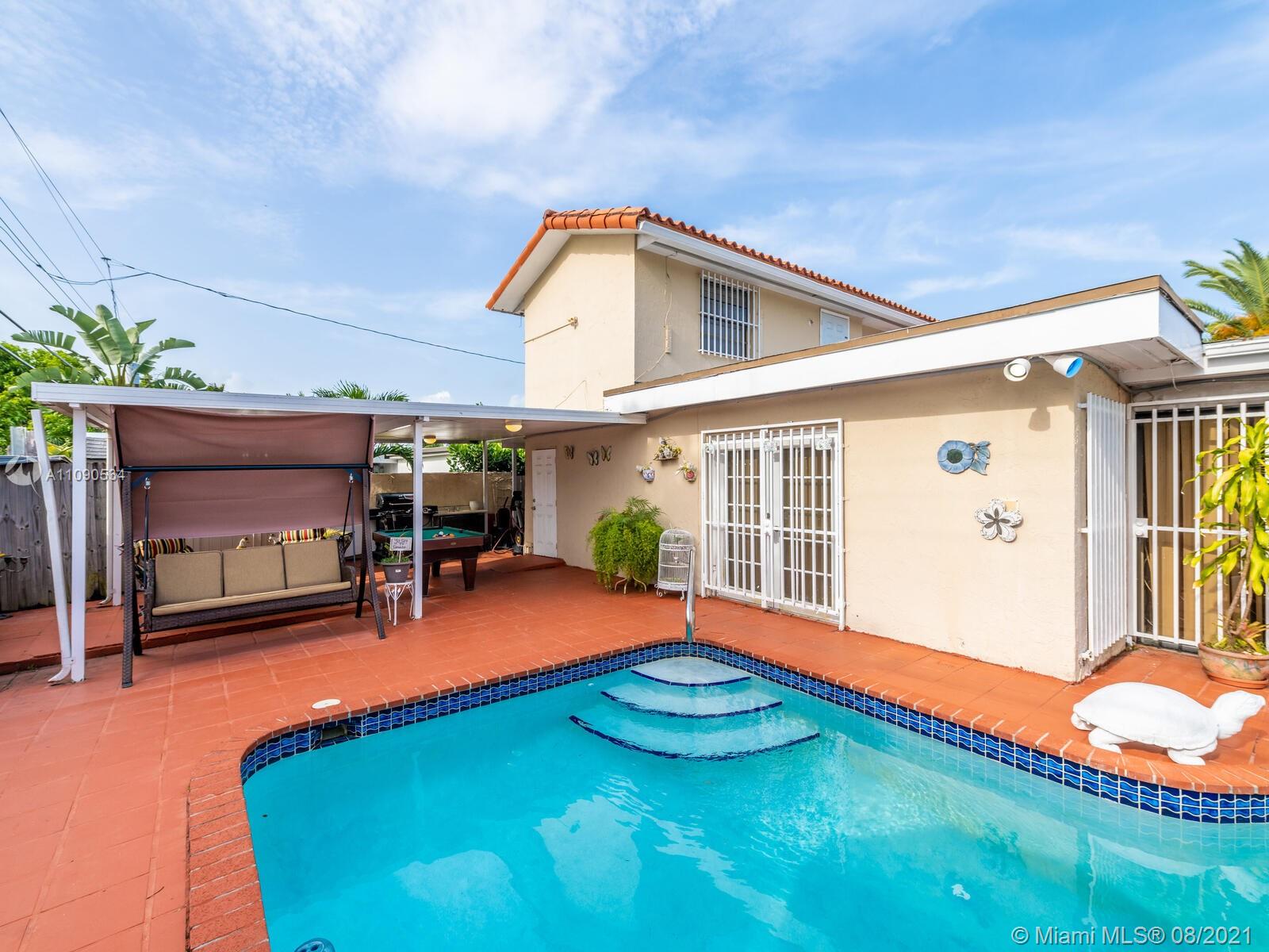 2820 Southwest 95th Avenue Miami, FL 33165 - Photo 64 of 100 a view of a house with swimming pool and porch