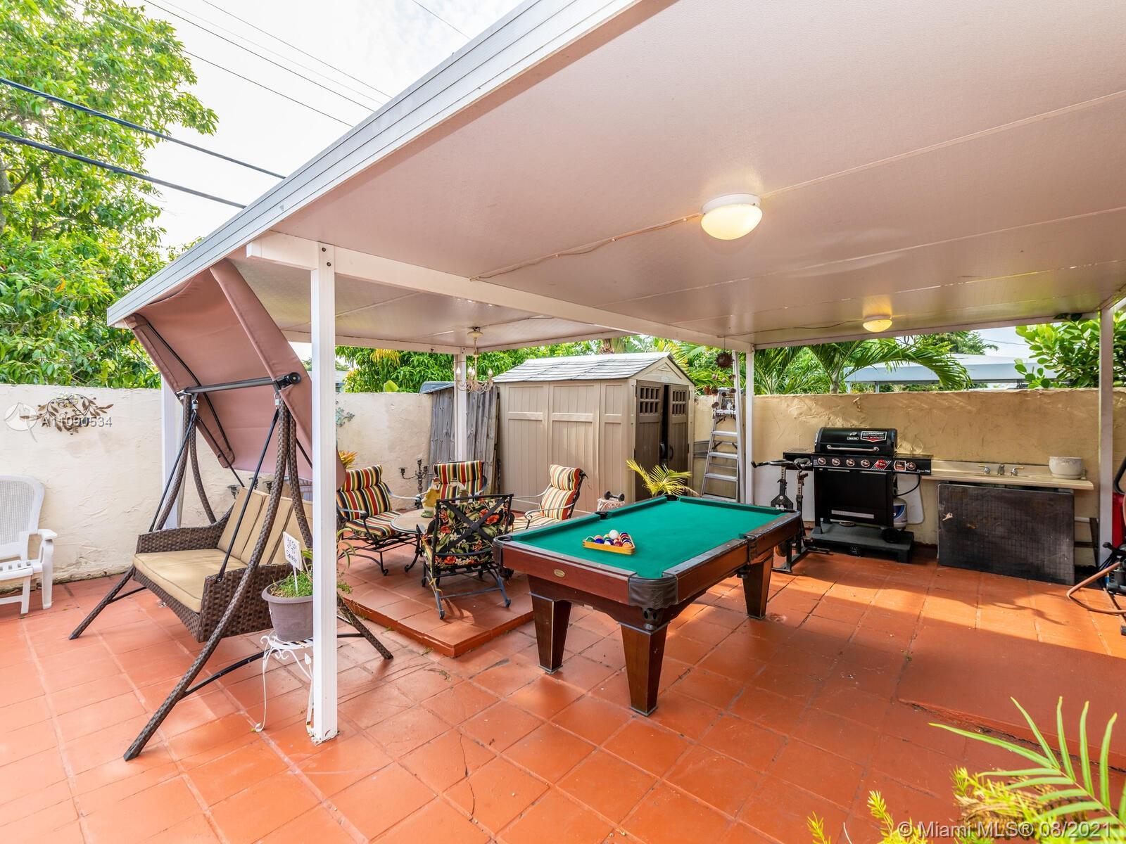 2820 Southwest 95th Avenue Miami, FL 33165 - Photo 65 of 100 a living room with furniture a table and chairs
