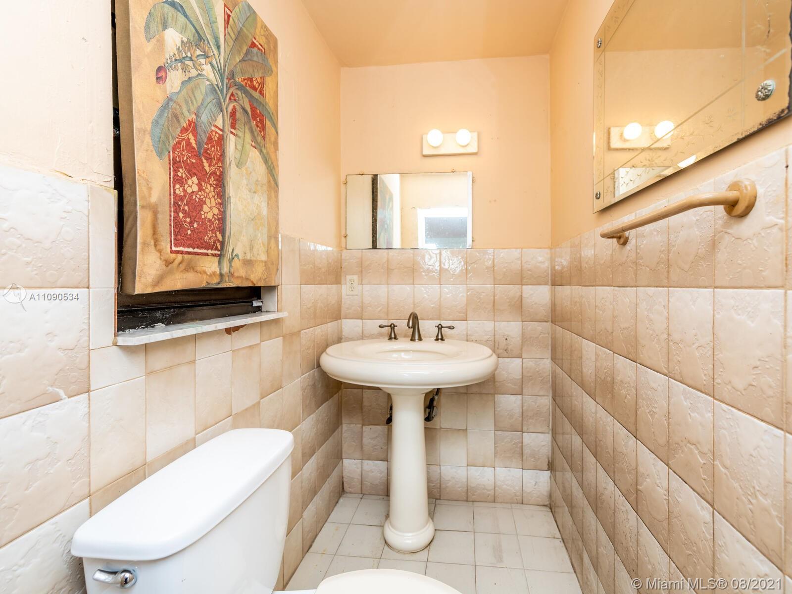 2820 Southwest 95th Avenue Miami, FL 33165 - Photo 69 of 100 a bathroom with a sink a toilet and shower