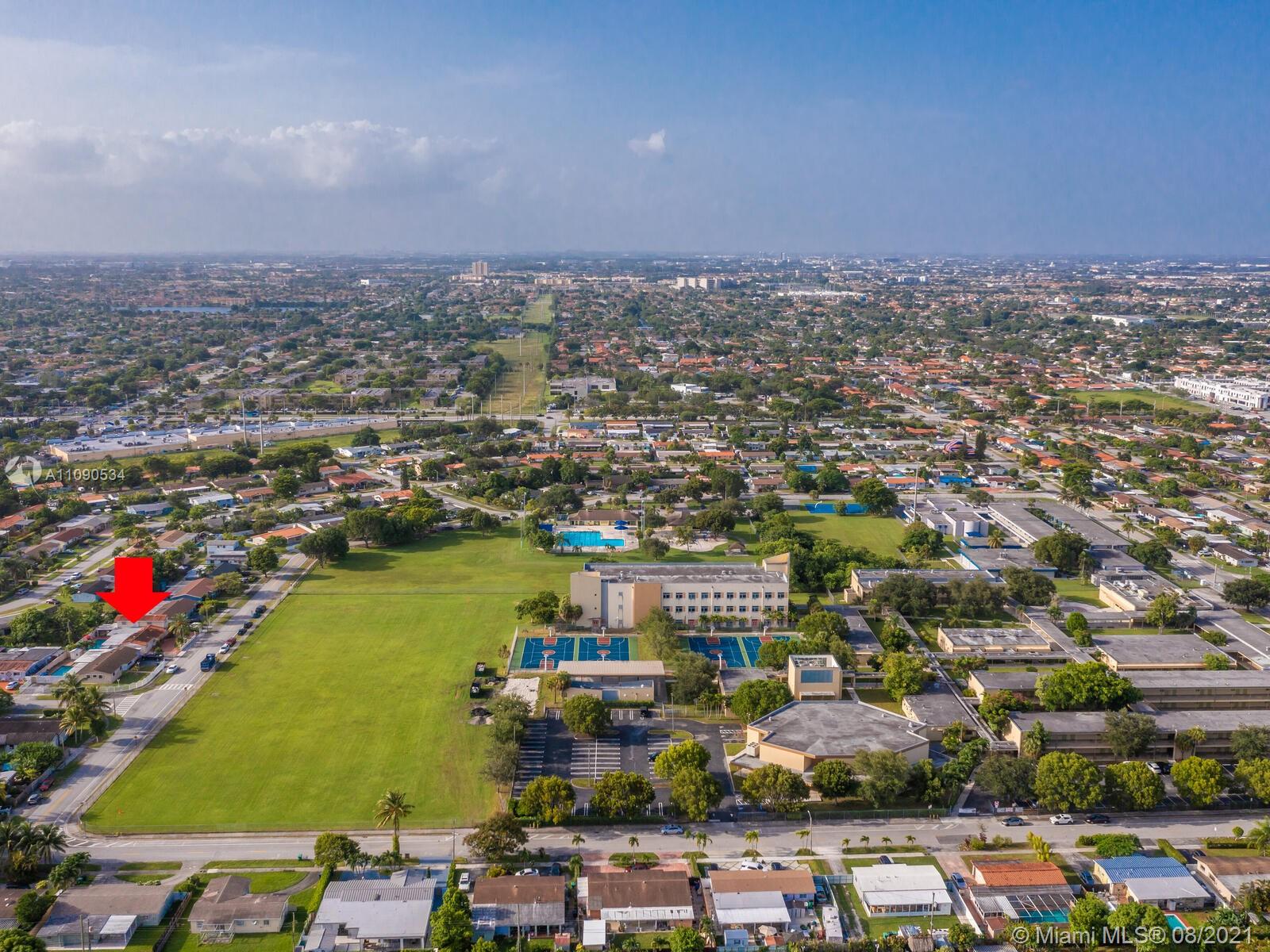 2820 Southwest 95th Avenue Miami, FL 33165 - Photo 74 of 100 an aerial view of a city with lots of residential buildings ocean and mountain view in back