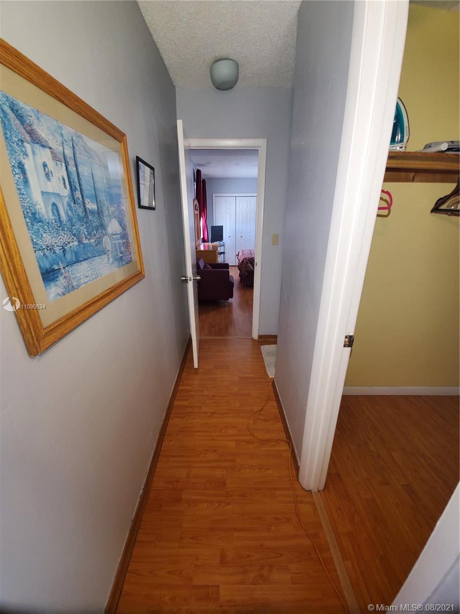2820 Southwest 95th Avenue Miami, FL 33165 - Photo 93 of 100 a view of a hallway with wooden floor and staircase