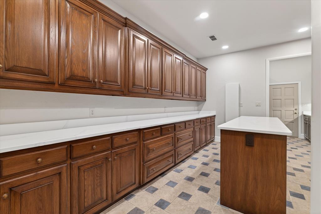 701 West Walcott Street Pilot Point, TX 76258 - Photo 37 of 40 Laundry room featuring recessed lighting and light flooring