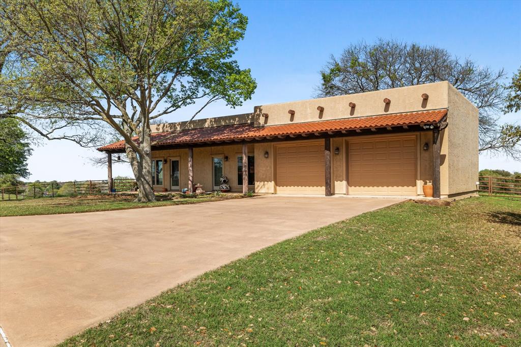 701 West Walcott Street Pilot Point, TX 76258 - Photo 10 of 40 a swimming pool with outdoor seating and yard