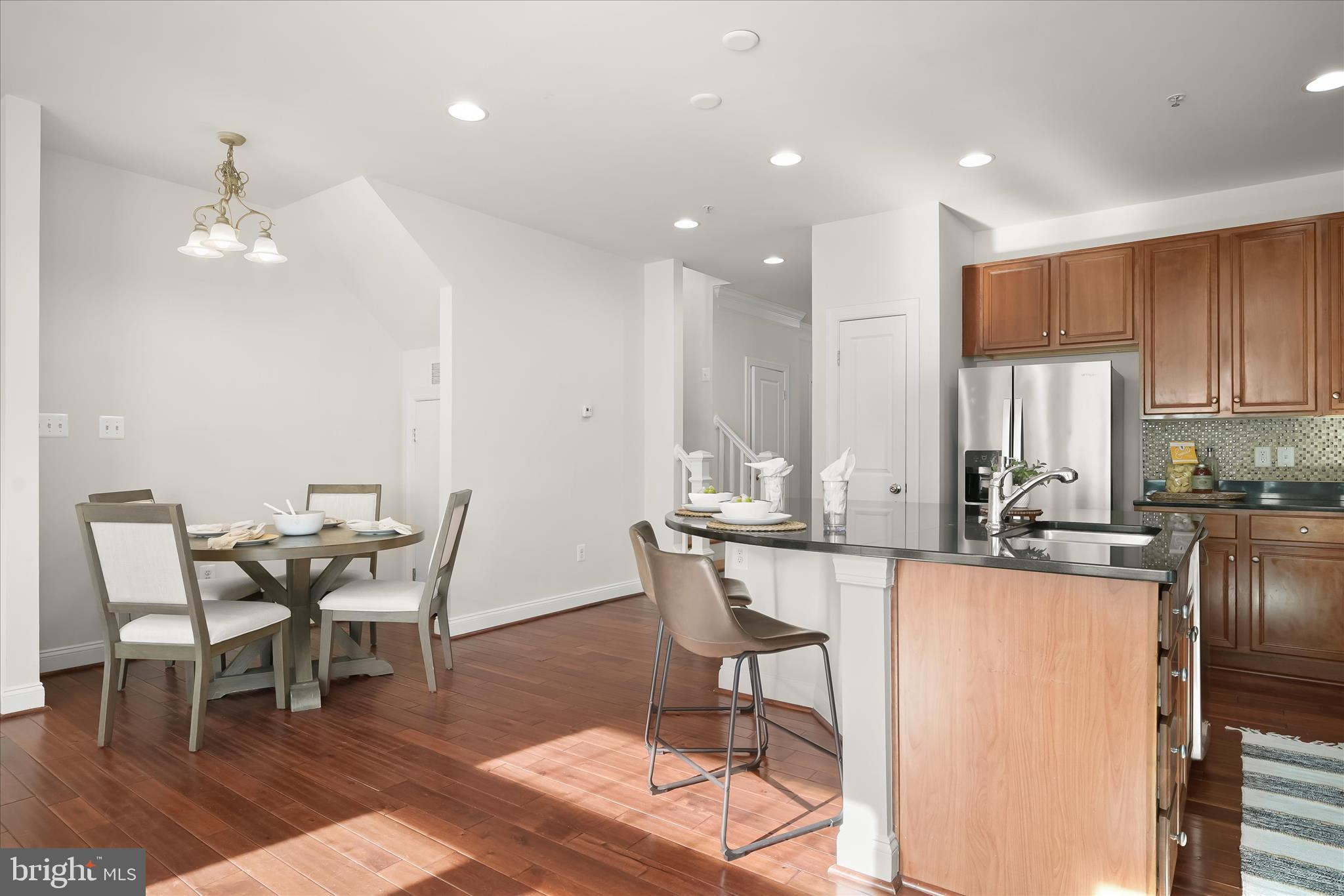 11419 Iager Boulevard Fulton, MD 20759 - Photo 13 of 58 a view of a dining room with furniture and wooden floor