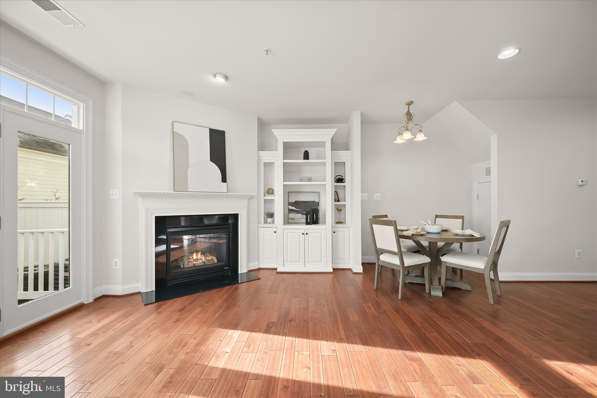 11419 Iager Boulevard Fulton, MD 20759 - Photo 18 of 58 a workspace with furniture wooden floor and a fireplace