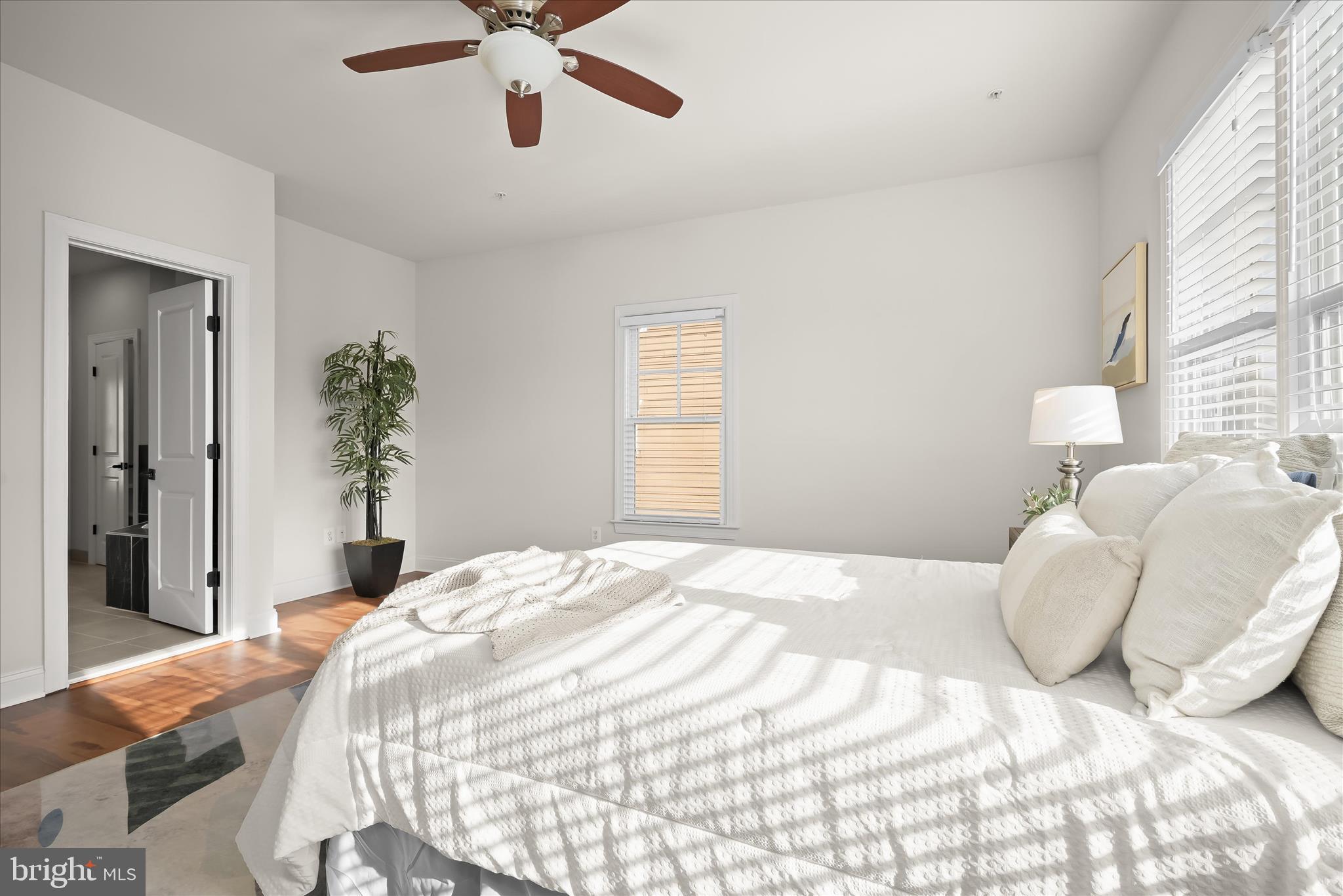11419 Iager Boulevard Fulton, MD 20759 - Photo 26 of 58 a bedroom with a bed and a chandelier