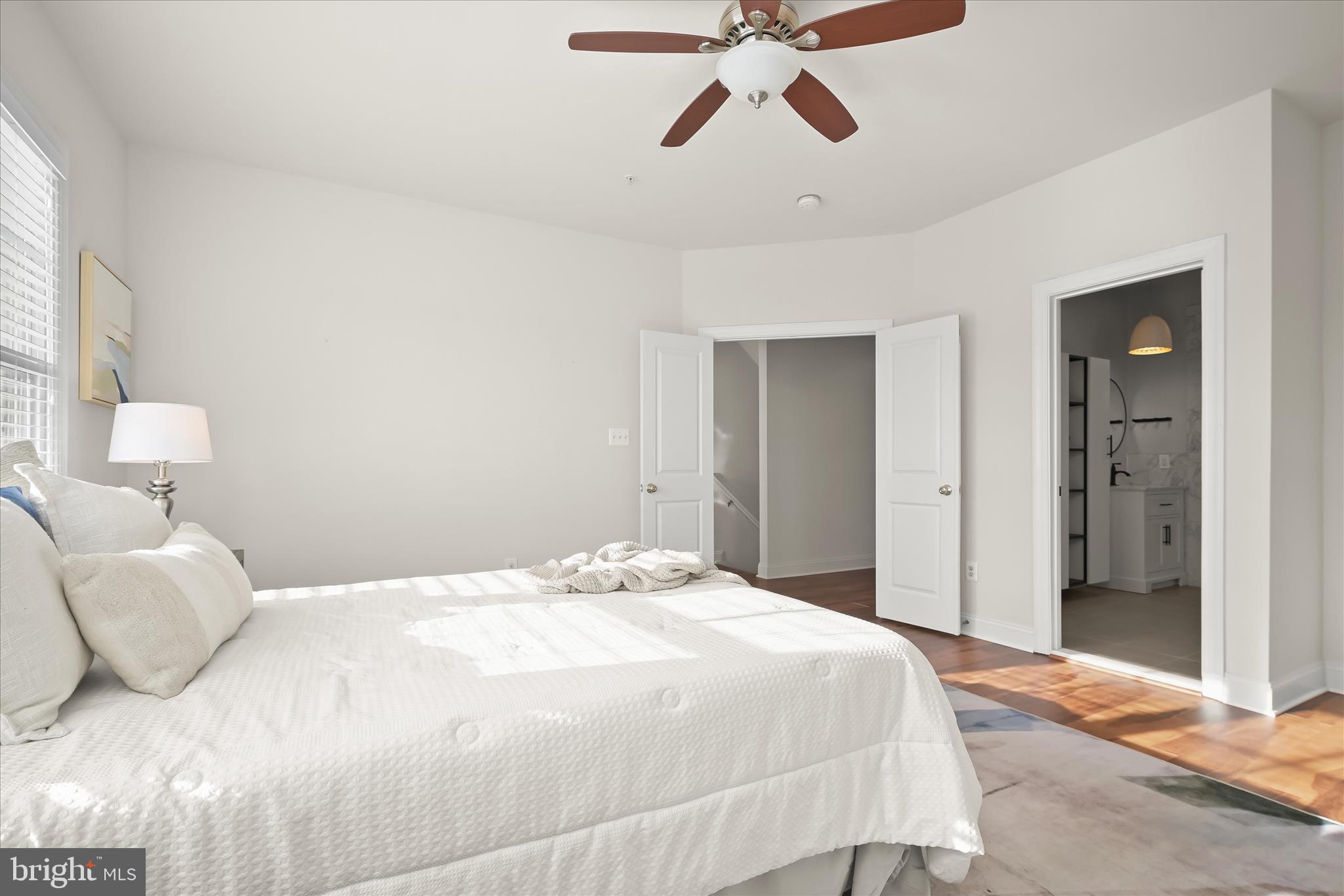 11419 Iager Boulevard Fulton, MD 20759 - Photo 28 of 58 a bedroom with a bed and lamp