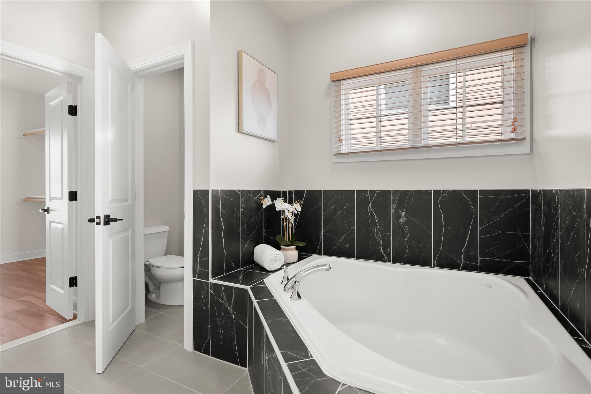 11419 Iager Boulevard Fulton, MD 20759 - Photo 34 of 58 a bathroom with a bathtub and shower
