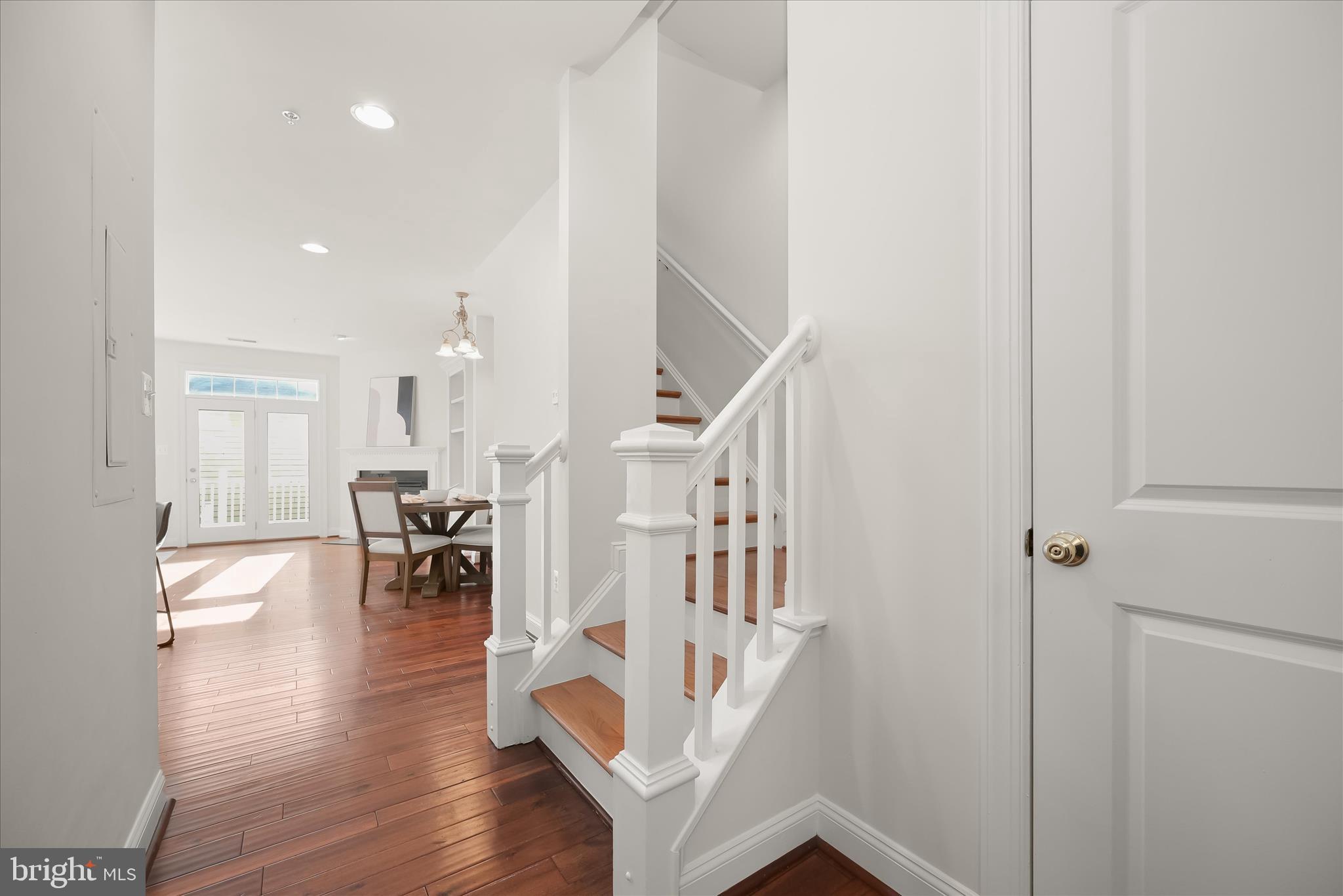 11419 Iager Boulevard Fulton, MD 20759 - Photo 6 of 58 a view of dining room with wooden floor and stairs