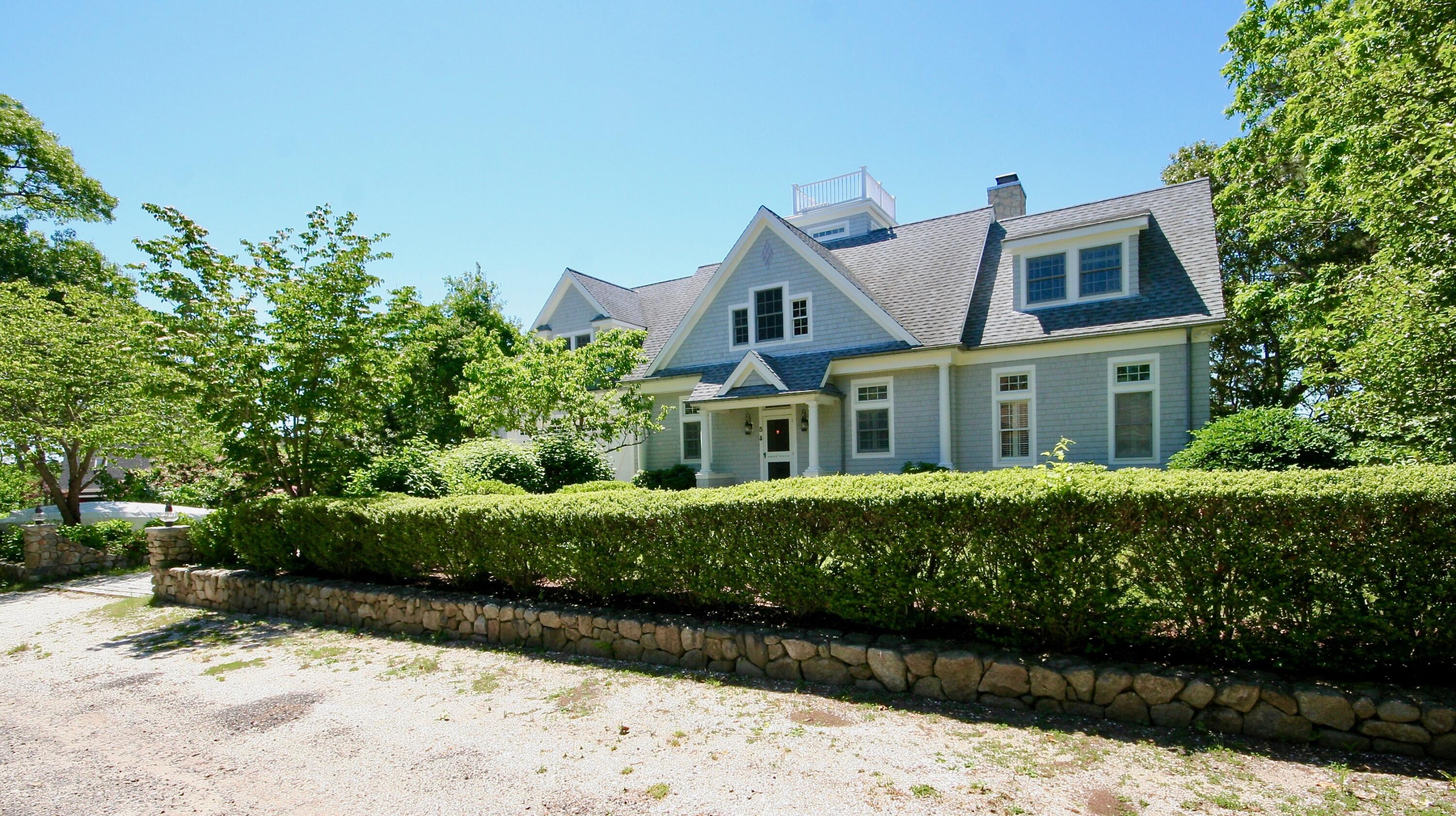 5 Point Road Mashpee, MA 02649 - Photo 1 of 29 a front view of a house with a yard