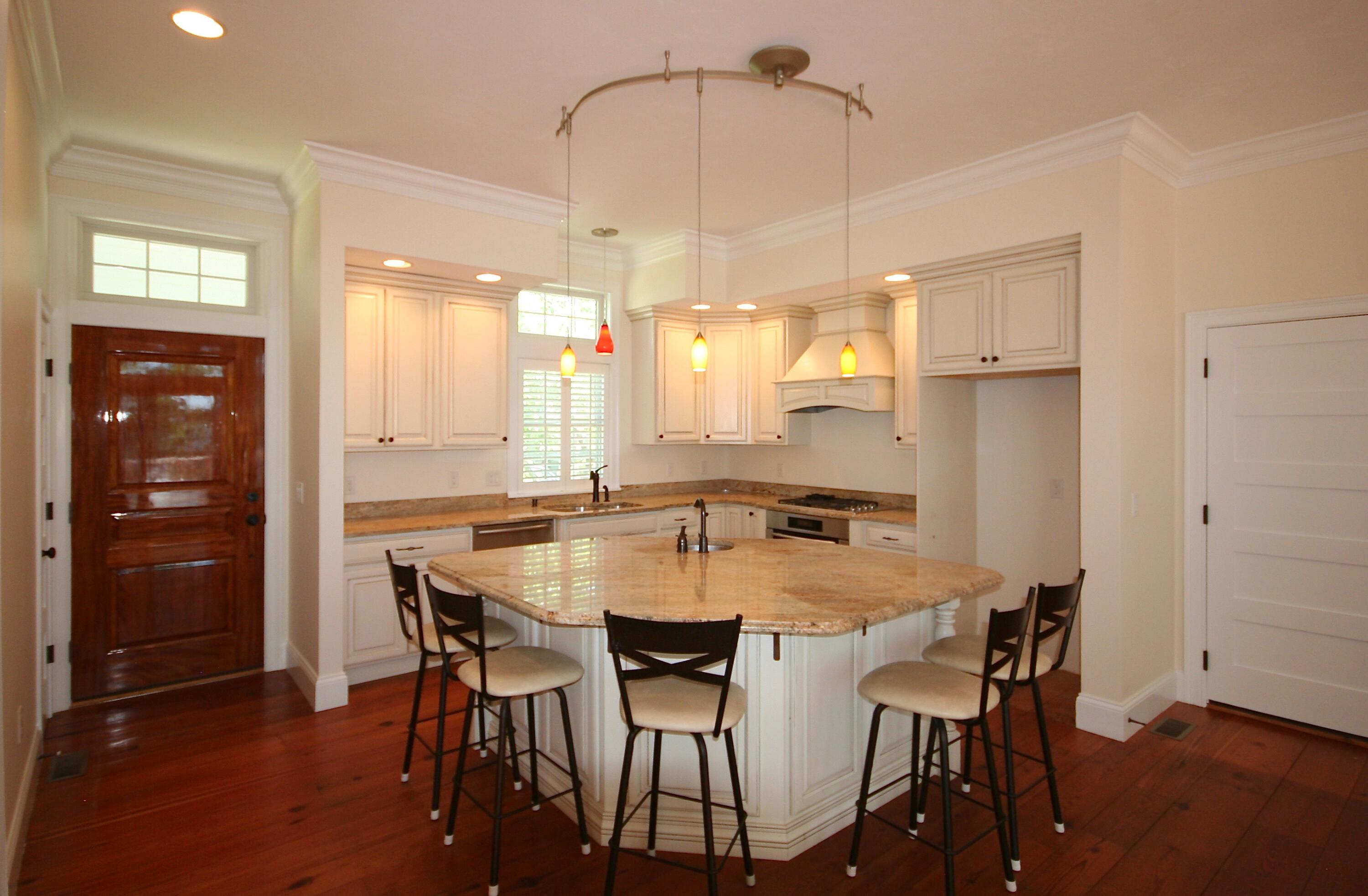 5 Point Road Mashpee, MA 02649 - Photo 13 of 29 a kitchen with a table and chairs in it